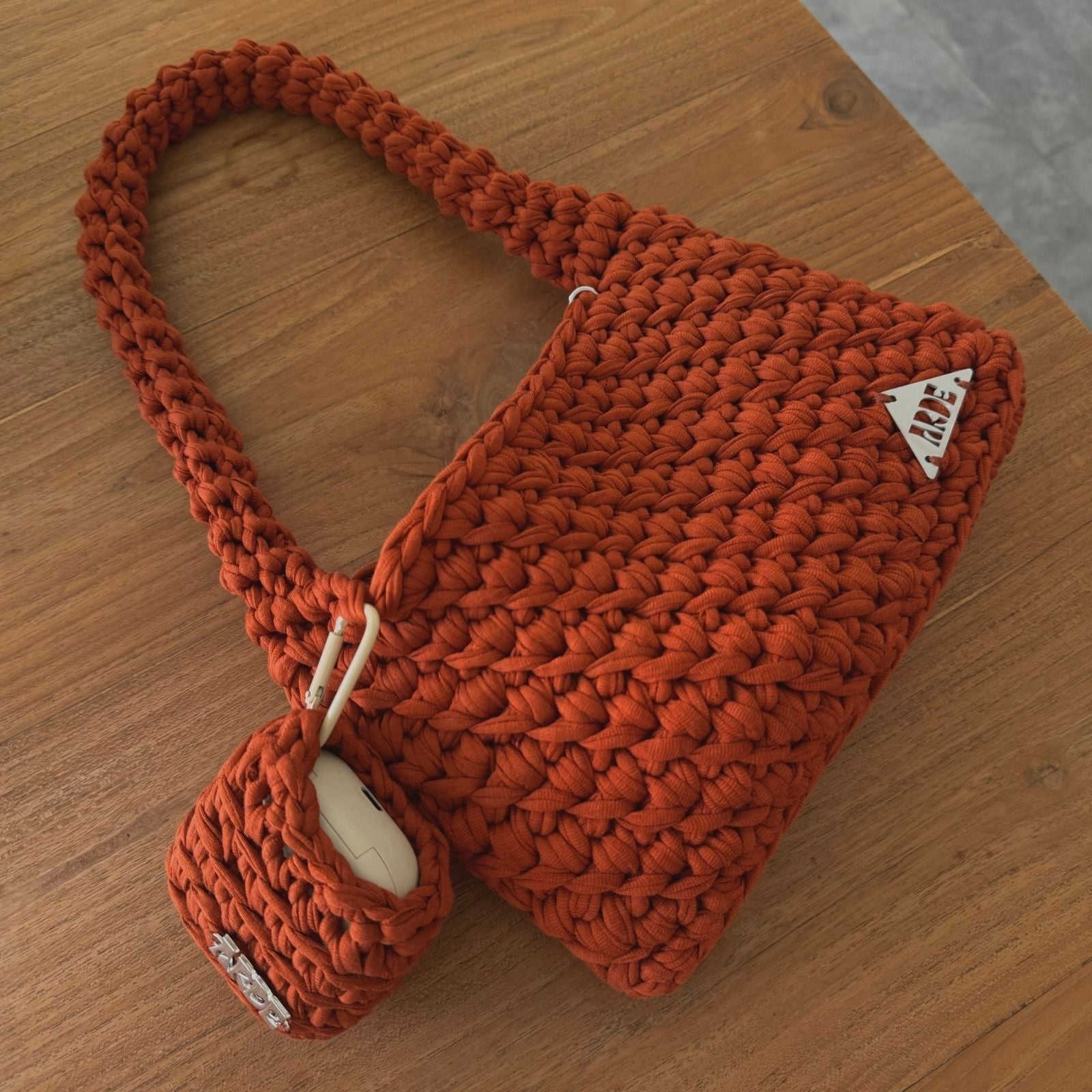 ethical fashion Arde bags and accessories in Australia wooden table cafe