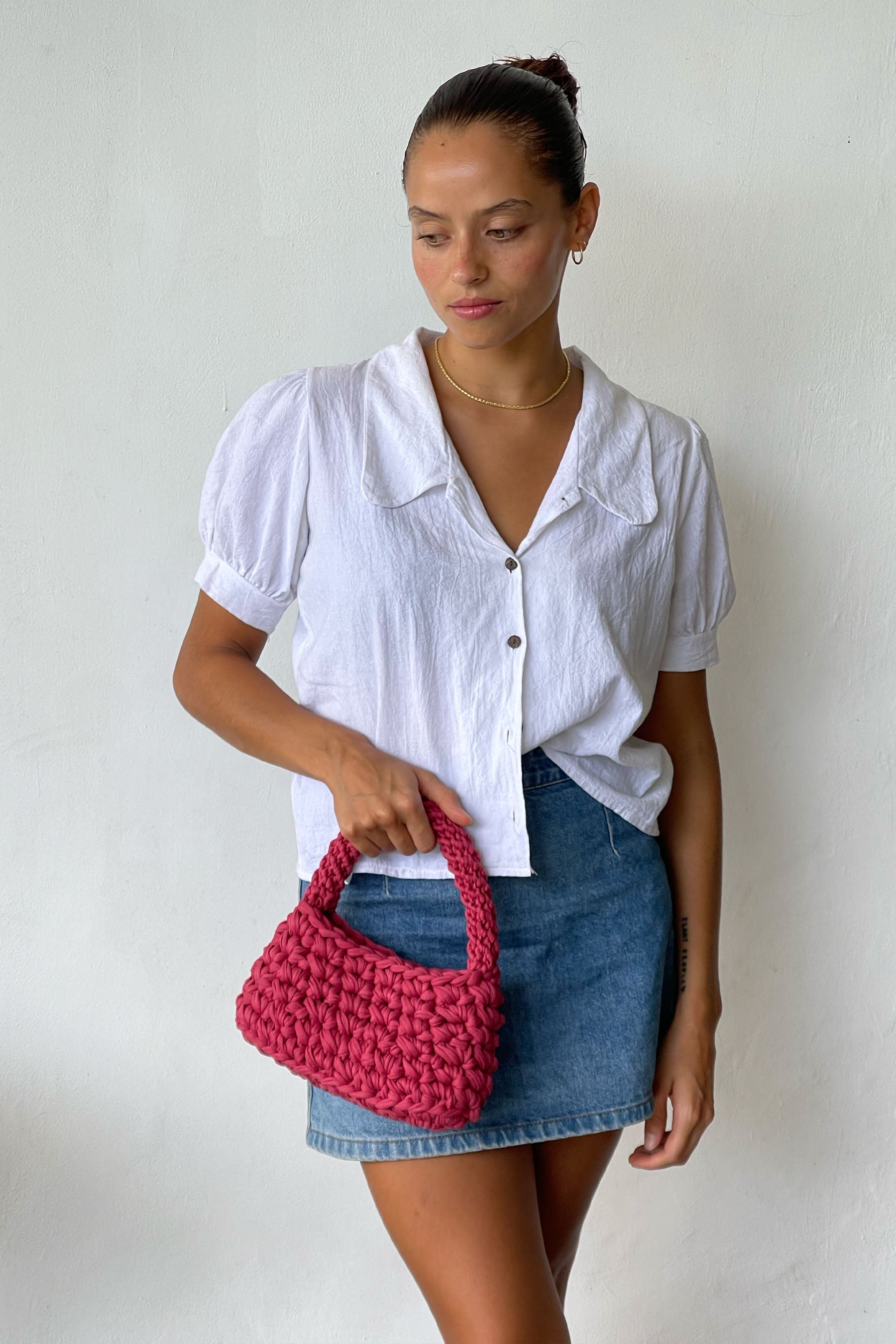 Woman Wearing A Cute Look Carring A Volcan Mini Bag In Rouge Colour
