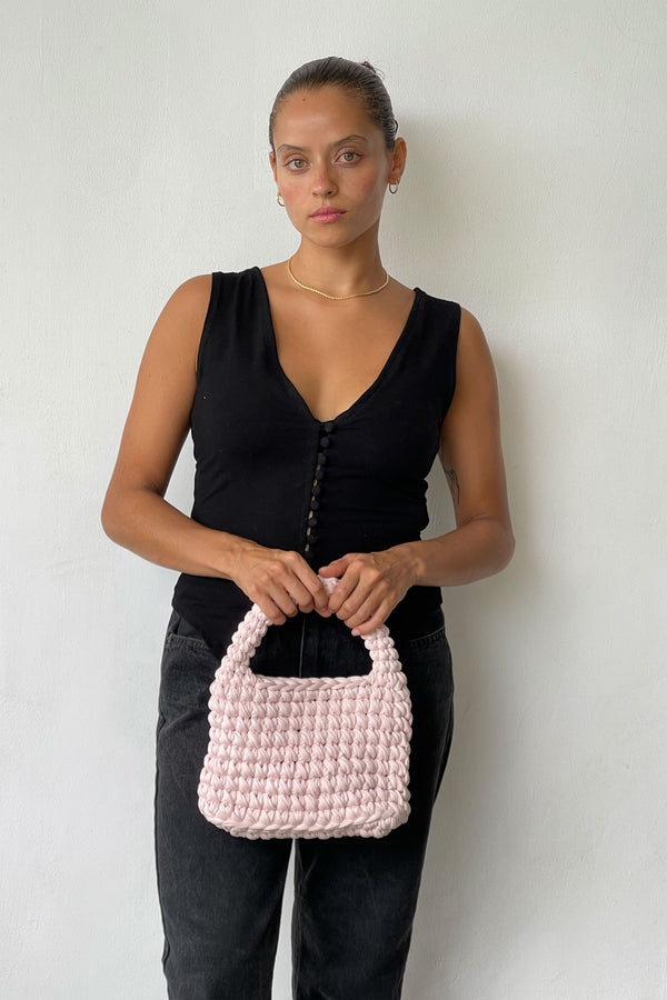 Woman Carring Her Eve Bag In Baby Pink